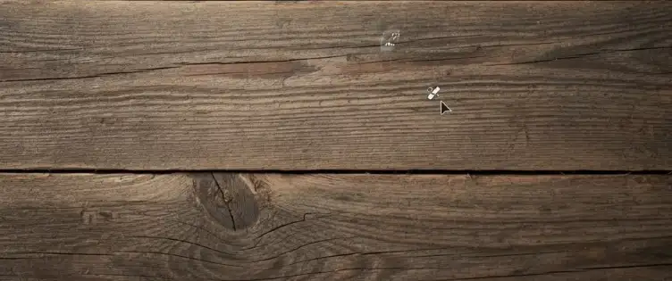 Photoshop Healing Brush blends repaired area after text removal, still less efficient than a free remove text from image tool for quick, clean results on detailed backgrounds with subtle shadows and seams.